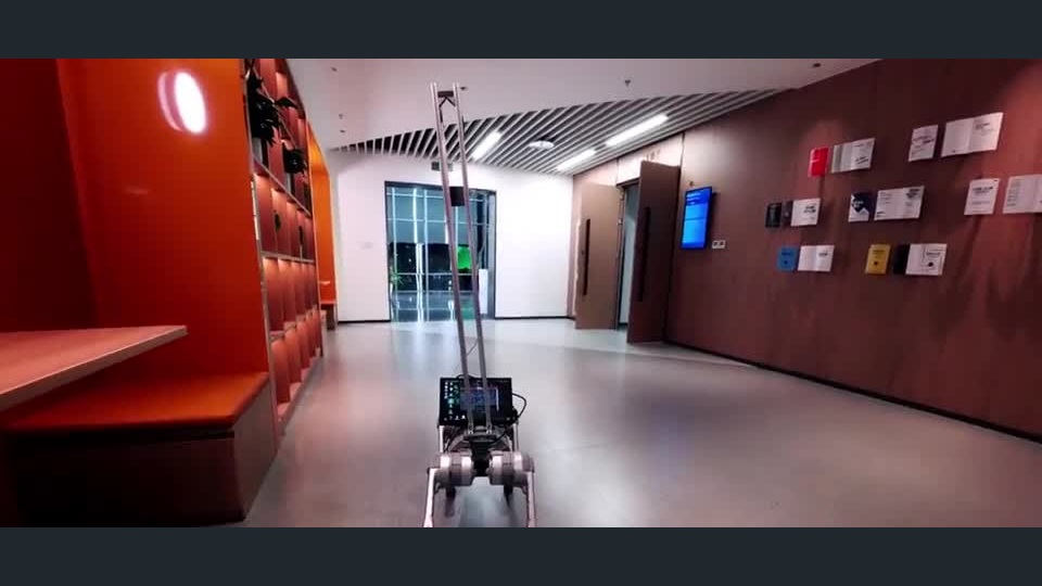 MemoryVLN robot in an indoor corridor during the official navigation demonstration.